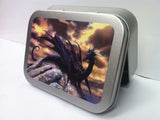 black-dragon-sitting-on-top-of-a-rock-game-of-thrones-mythic-creature-dark-skies-gold-sealed-lid-2oz-tobacco-storage-tin